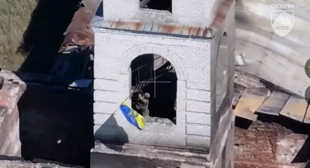 Ukrainian warrior is raising national flag over an orthodox charch in the settlement of Zarichne in Donetsk region, 1295 Days of russia-Ukraine War – russian Casualties in Ukraine