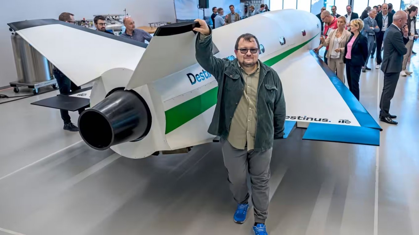 Mikhail Kokorich poses in front of Destinus, a jet-powered UAV and the main product of the company