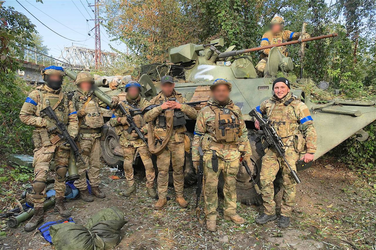 Soldiers of Kraken special unit in front of the captured russian BMP-1AM Basurmanin after the liberation of Kupisansk-Vuzlovyi, October 2022