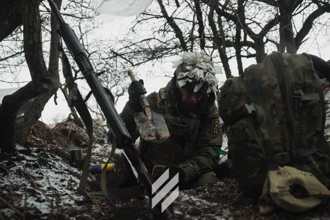 A warrioir of the 3rd separate assault brigade diging into the ground somwhere near Bakhmut, Ukraine Ground Forces Commander Says the Situation Around Bakhmut Remains Difficult but the Defense of the Fortress Continues, Defense Express