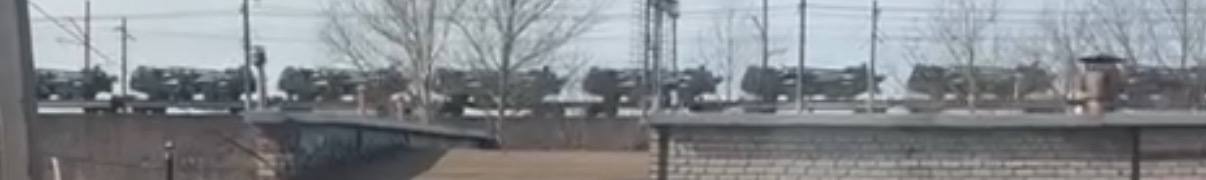 Train carrying russian wheeled self-propelled guns, either Malva or Giatsint-K type, February 2025 / Defense Express / Malva or Giatsint-K: russians Boast Mass Production of Wheeled Artillery