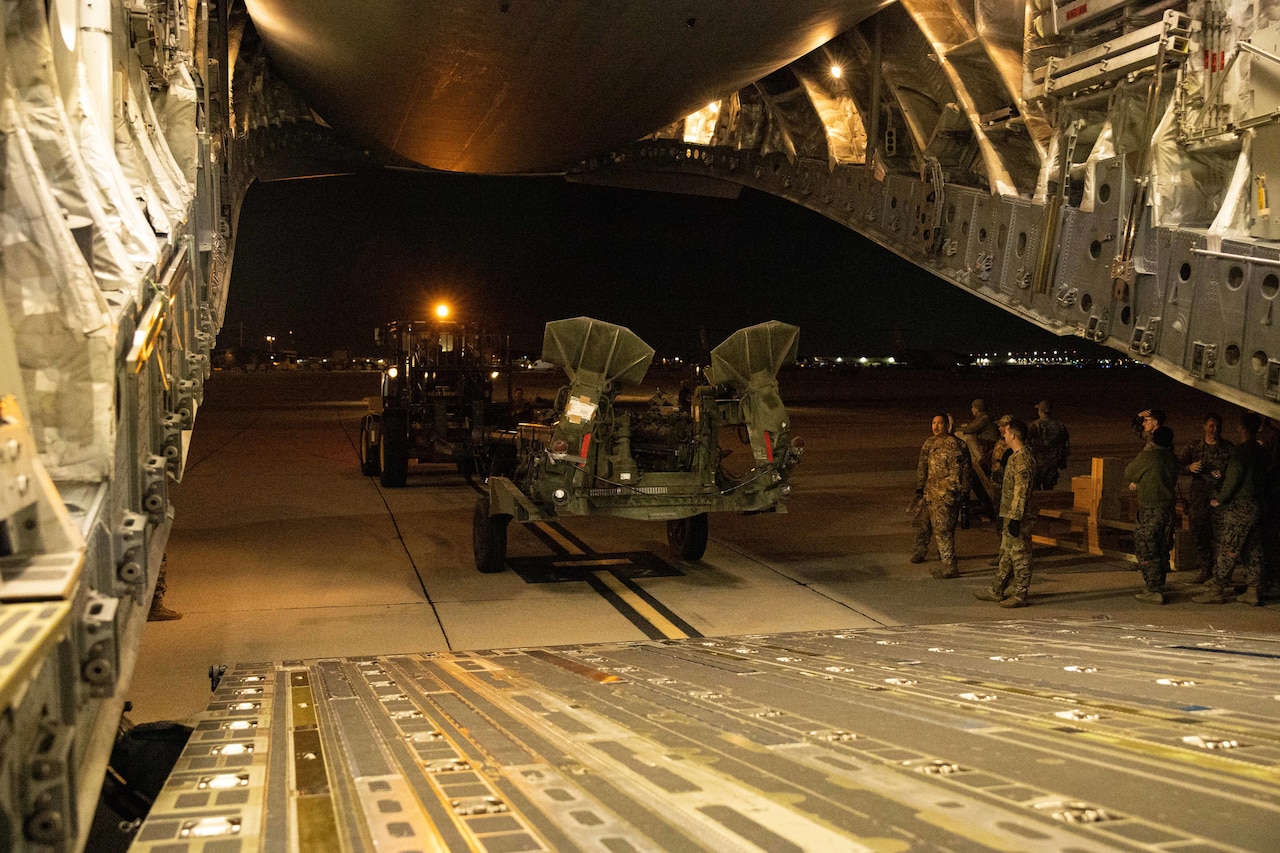 M777 howitzers loaded on an Air Force C-17 Globemaster III military transport aircraft