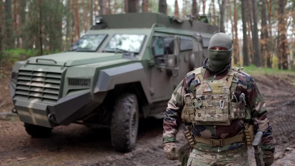 Soldier of the Kraken special operations unit next to the Senator APC