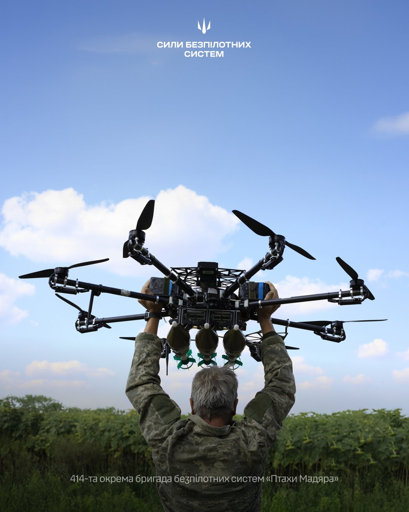 A Ukrainian soldier launches a drone on the battlefield