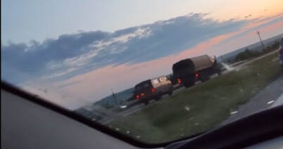 UAZ van and a truck in a column moving, presumably, toward Rostov-on-Don, on the morning of June 24, 2023