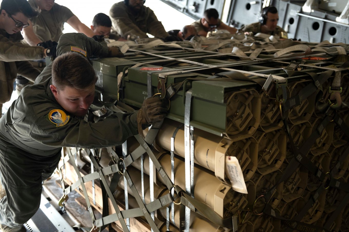 U.S. Air Force airmen load pallets of 155mm howitzer rounds for shipment to Ukraine. April 2022, Travis Air Force Base, Calif.