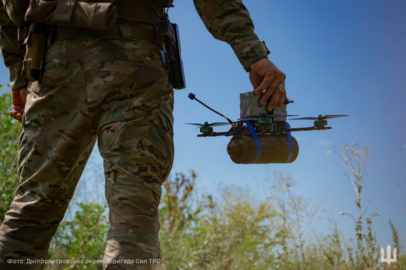 Ukrainian soldier holding an FPV drone