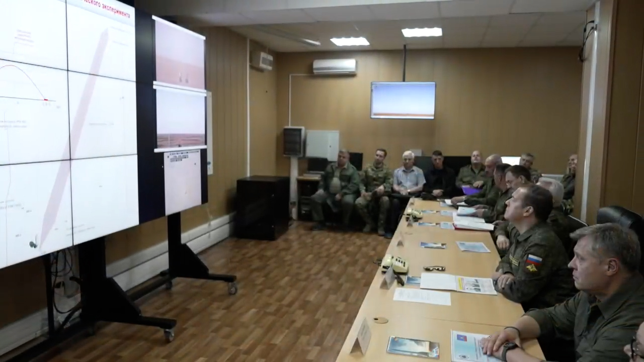 Dmitry Medvedev oversees the new missile live firings, surrounded by military officers