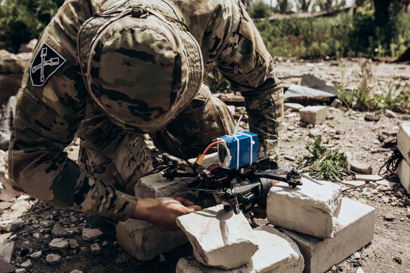 Illustrative photo: a Ukrainian soldier prepares an FPV drone for a sortie