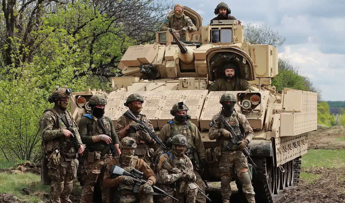 Warriors of some unit of the 47th Mechanized Brigade Magura of the Armed Forces of Ukraine near their combat vehicle