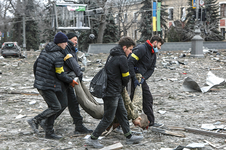 UN High Commissioner for Human Rights, Ukrainian volunteers carry a victim out of the City Hall building, following shelling in Kharkiv,1,232 civilians killed in Ukraine since Russian invasion began, Defense Express