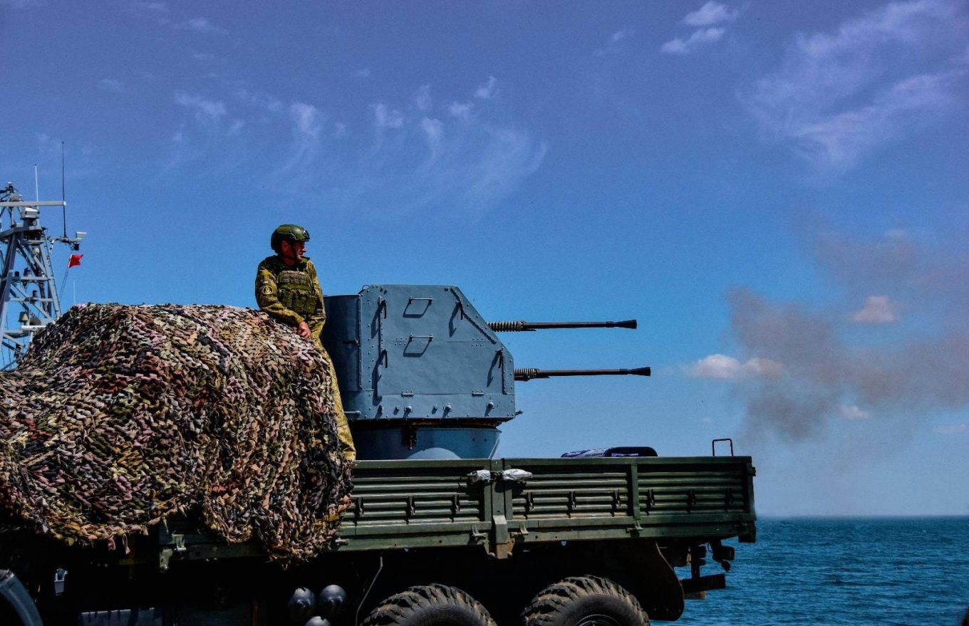 Gun truck with equipped with a 2M-3M naval AA gun during the shooting training  in July 2023