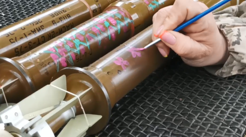 A Ukrainian soldier decorating projectiles to the National Day of Vyshyvanka – the embroidered shird (celebrated on May 19)