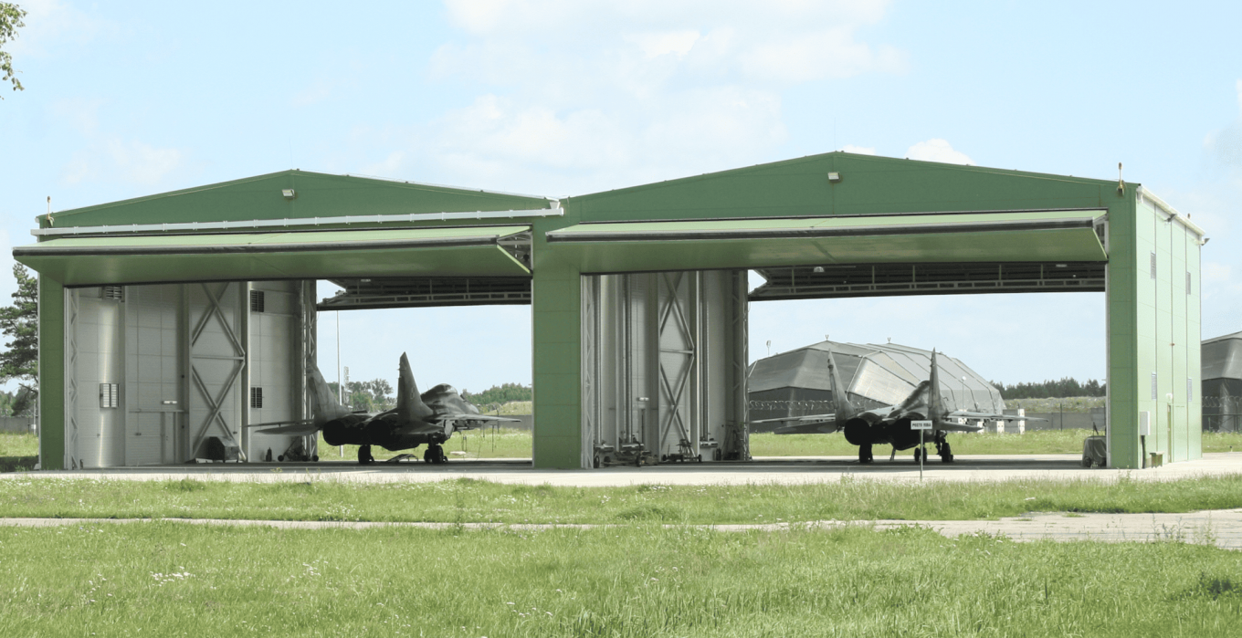 Polish MiG-29s in hangars at a military base in Lithuania