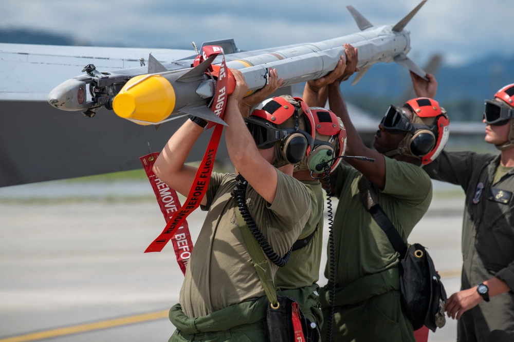 U.S. Marines load an AIM-9X Sidewinder missile onto an F/A-18D Hornet aircraft