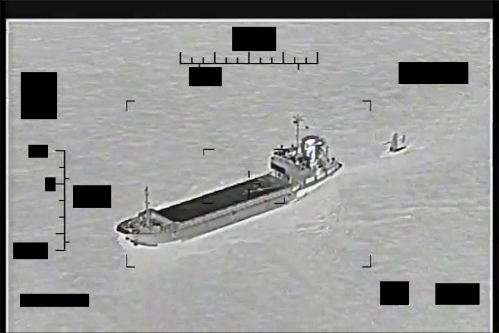 iranian IRGCN ship Shahid Baziar towing a Saildrone Explorer, filmed by a U.S. MH-60S Sea Hawk