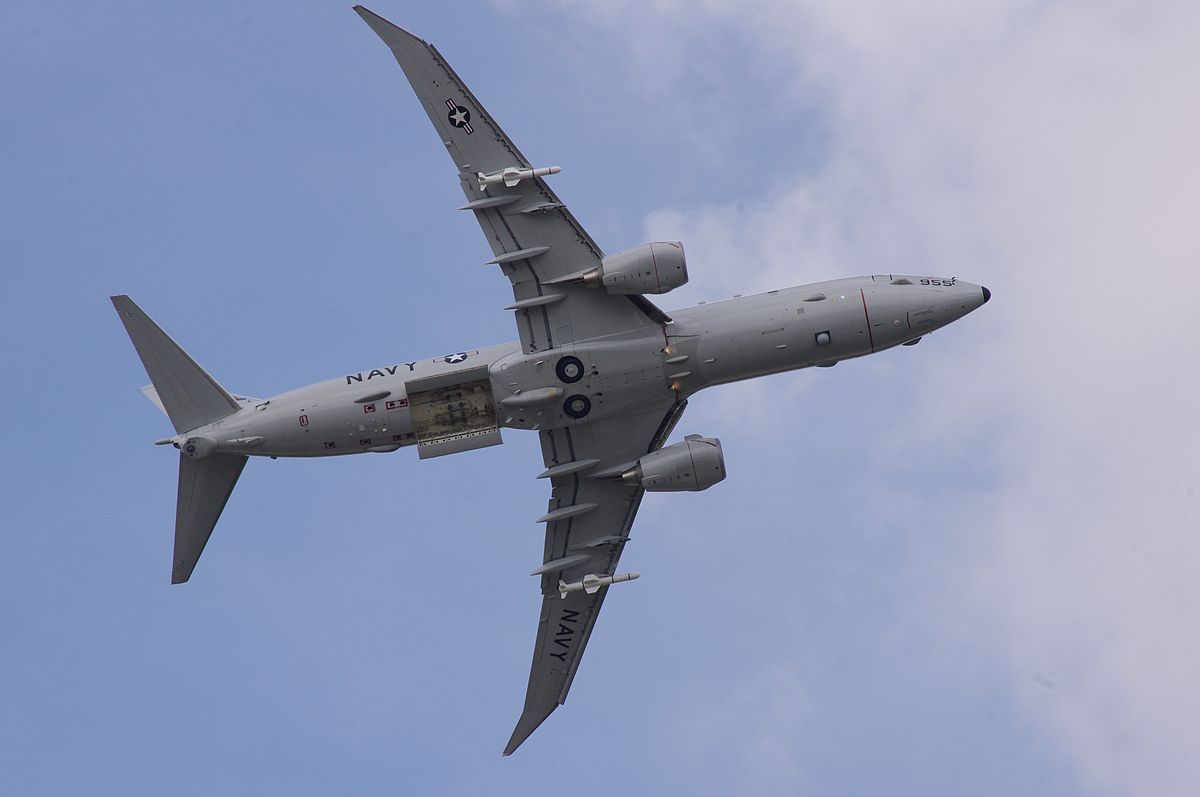P-8 Poseidon with open bomb bay and two UGM-84 Harpoon missiles mounted on wing pylons