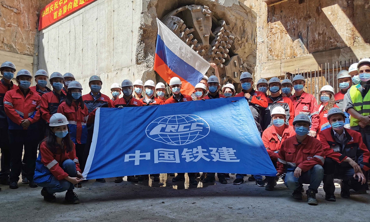 Chinese Railroad Construction Company workers celebrate the completion of the company's first subway tunnel in Moscow, in 2020