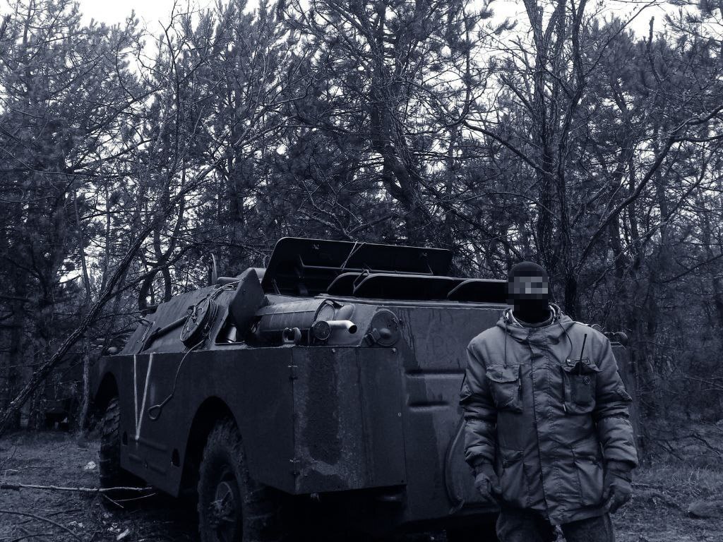 A russian soldier next to a 9P148 Konkurs anti-tank missile system used for battles near Vuhledar