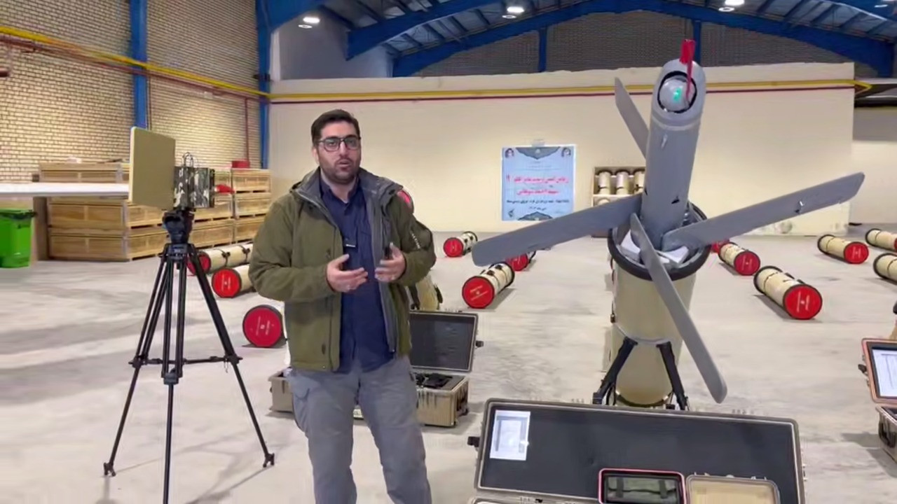 What Is This Super-Powerful Iranian Loitering Munition, Shown at Exhibition in Serbia, Rezvan loitering munition in Iran, on the left on a tripod stands the antenna of the system's control station