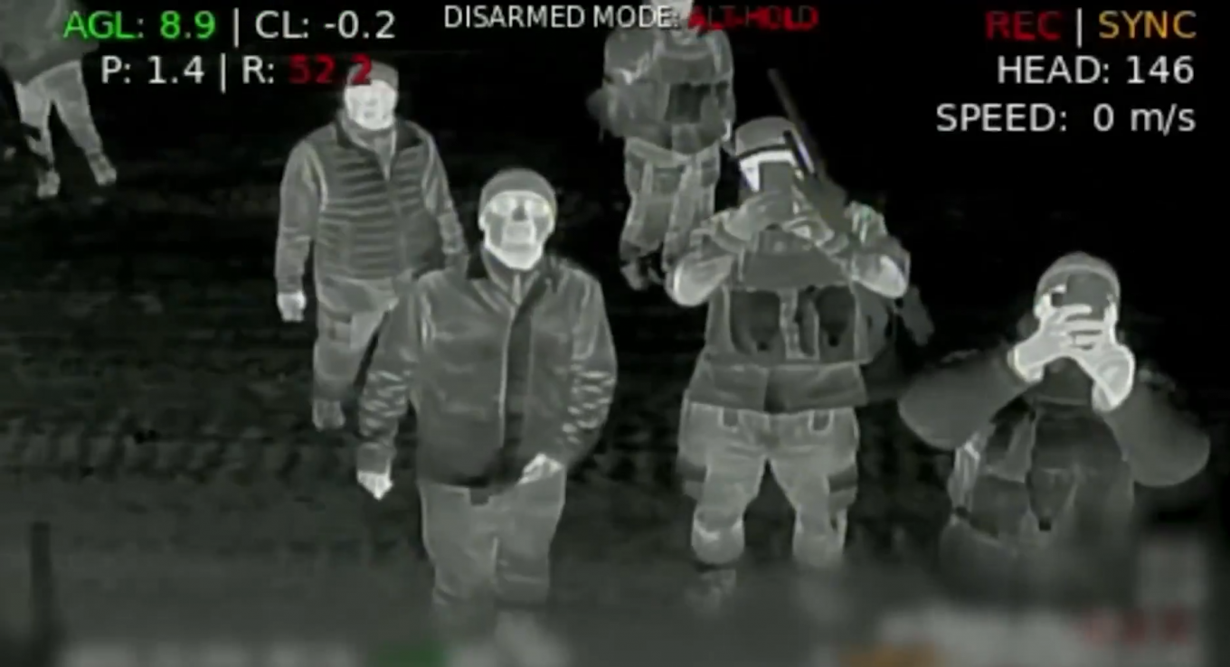 A group of russian servicemen photographing the Ukrainian drone from Lasar's Group
