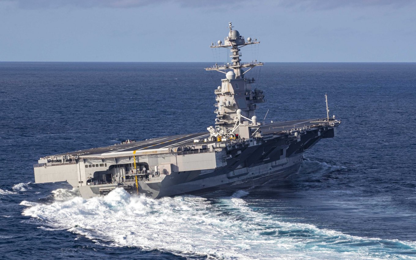 U.S. Navy Ford-class carrier performing a sharp turn