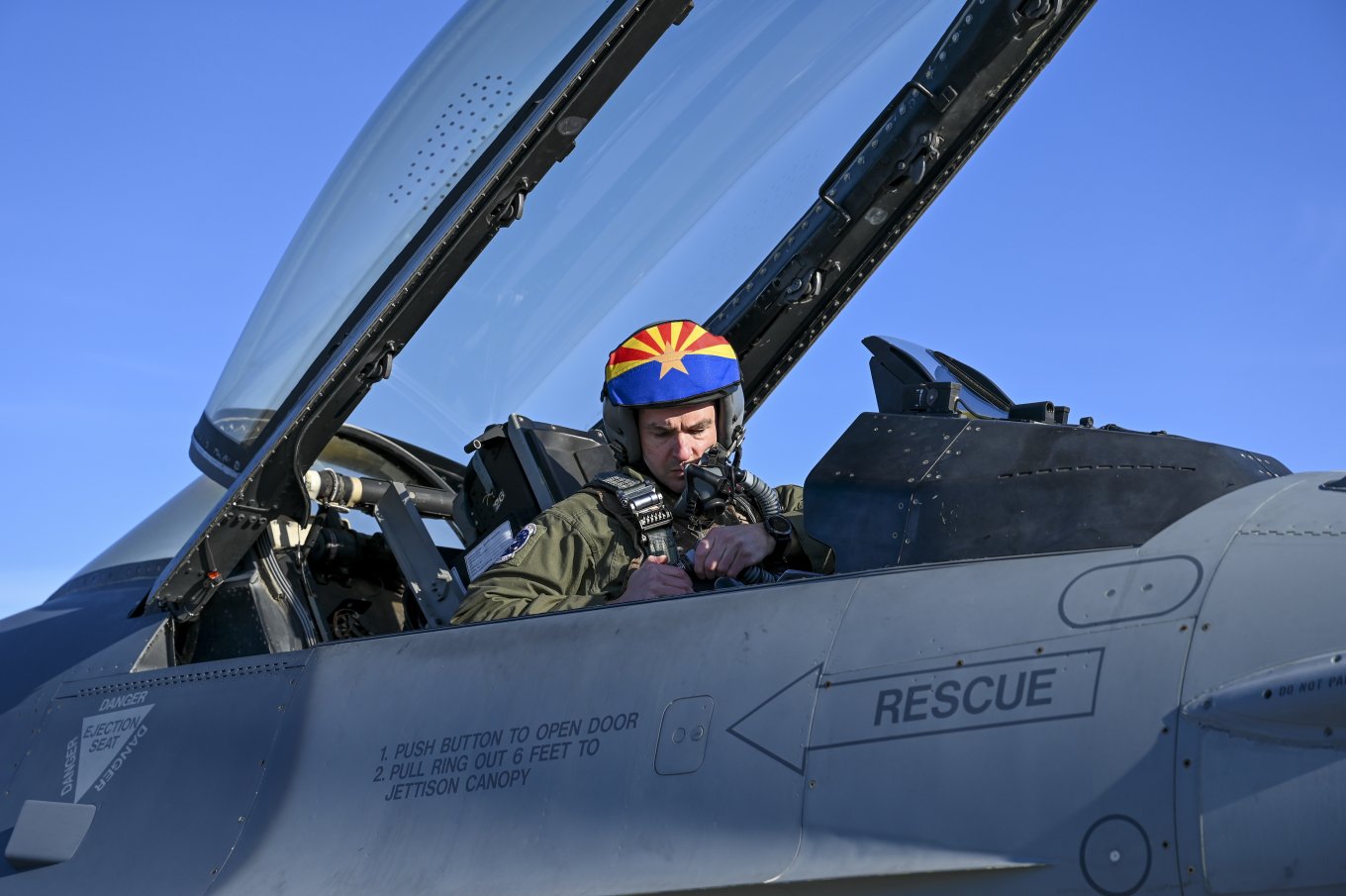 A pilot prepares to fly an F-16 Fighting Falcon aircraft, Alaska, May 5, Northern Edge 2023 Defense Express U.S. Tested Angry Kitten EW System on F-16 and A-10A Aircraft, Tanker Intelligent Gateway on KC-135R Tanker, and Upgraded MQ-9 Reaper UAV