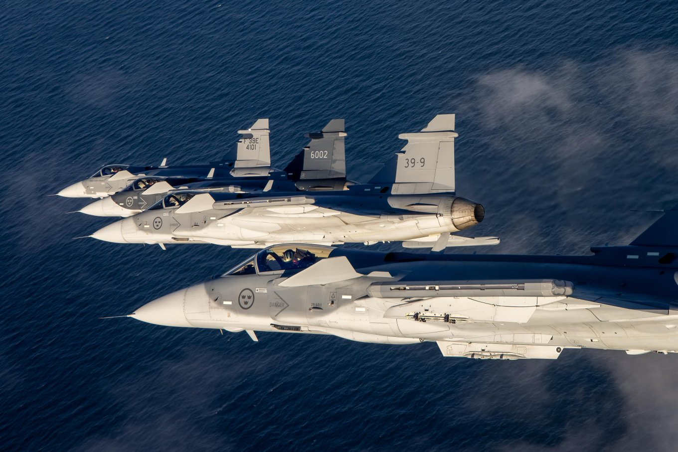 Tight four ship formation of Gripen E fighter jets Saab AB