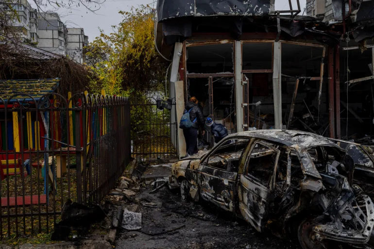 Residents inspect damage of shop destroyed in a Russian attack in Kherson, November 25, UK Defense Intelligence States Kherson City Suffer Daily Bombardment by Russian Artillery, Defense Express