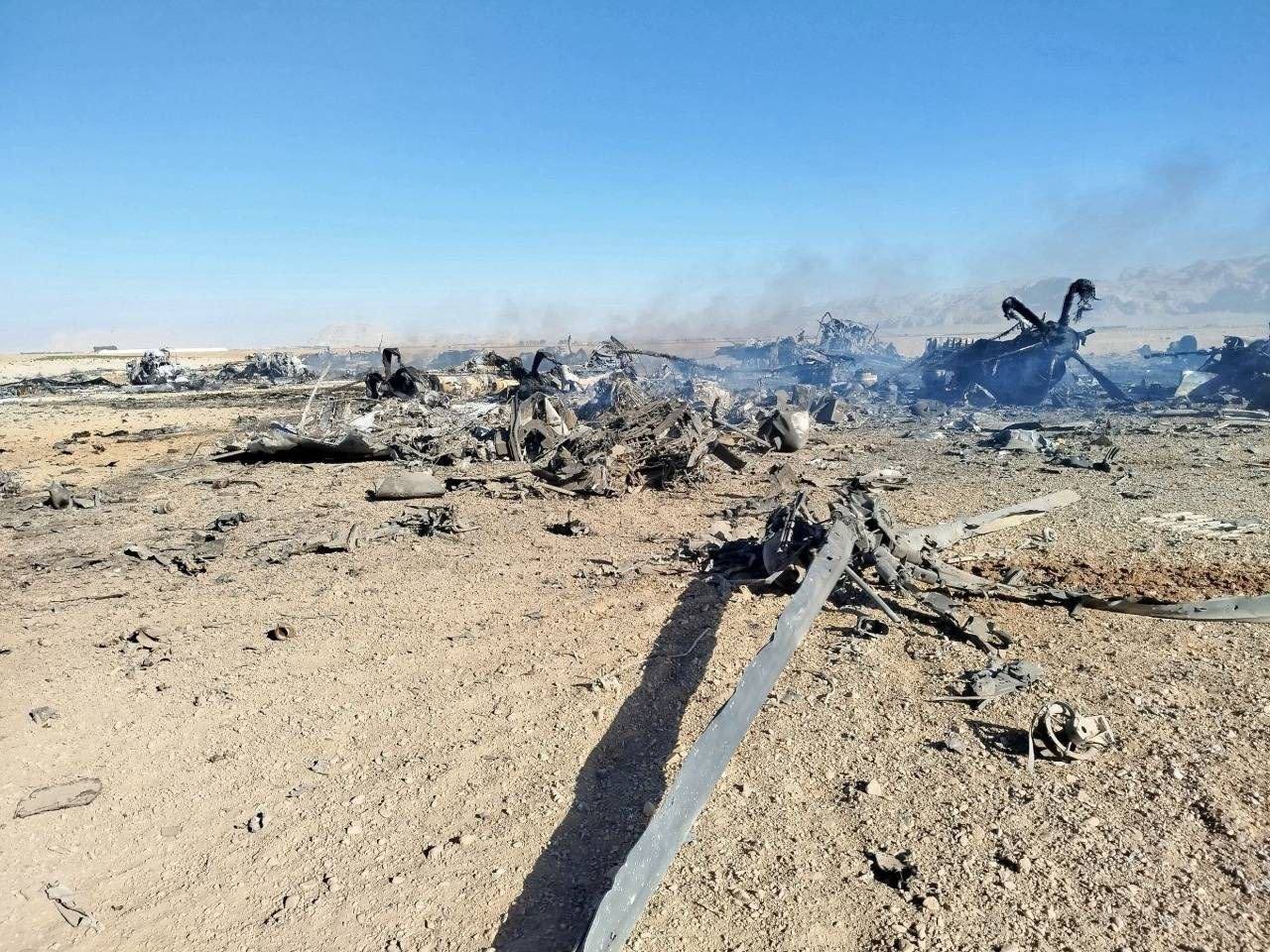 Remains of two destroyed MC-130J Commando IIs and several MH-6 Little Birds at forward base in iran