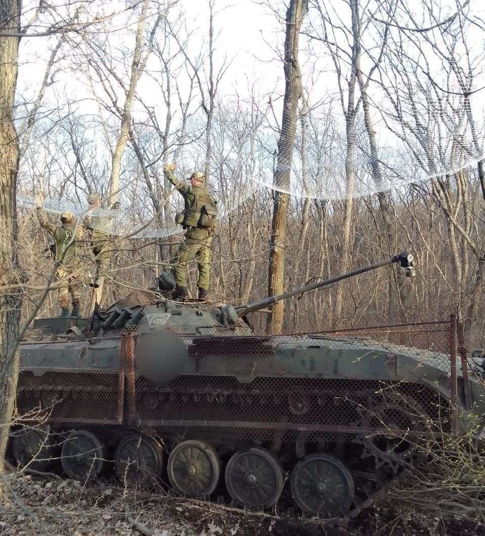 The BMP-2 vehicle with a mesh above and welded wire mesh attached to the sides Defense Express