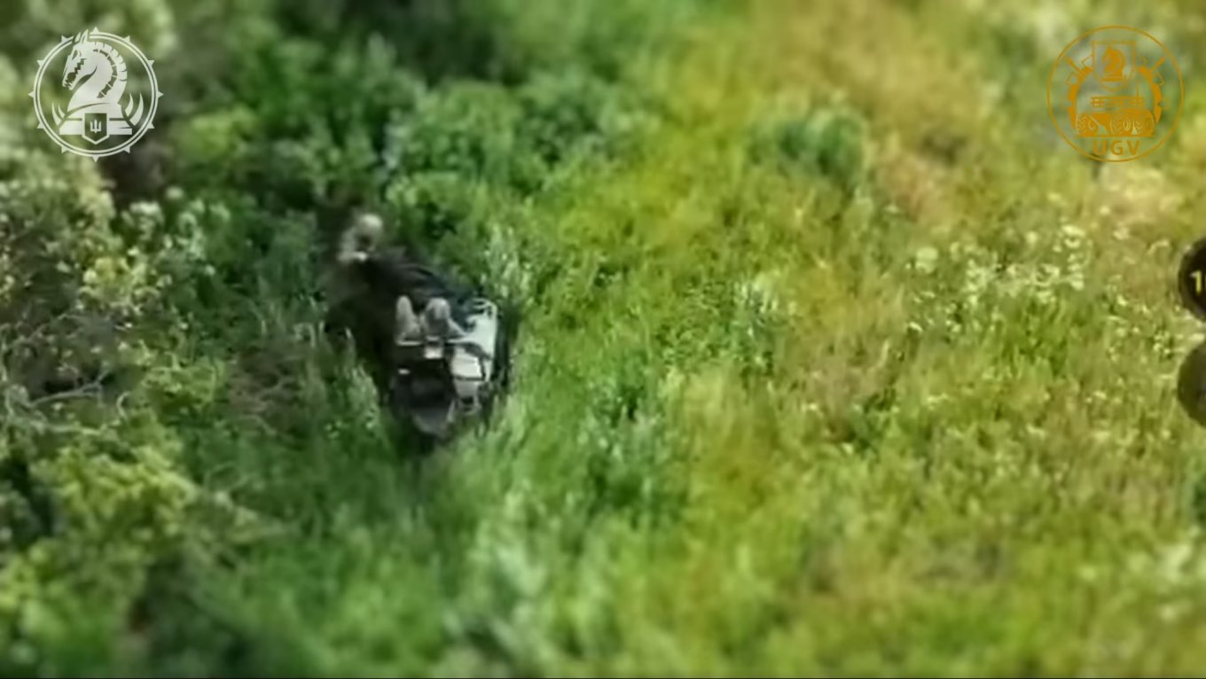 The injured soldier is seated in the cargo compartment of the UGV and concealed with a black canopy / Defense Express / Three Days of Planning, UAV Escort: Drone Resupply Missions Are Not Easy