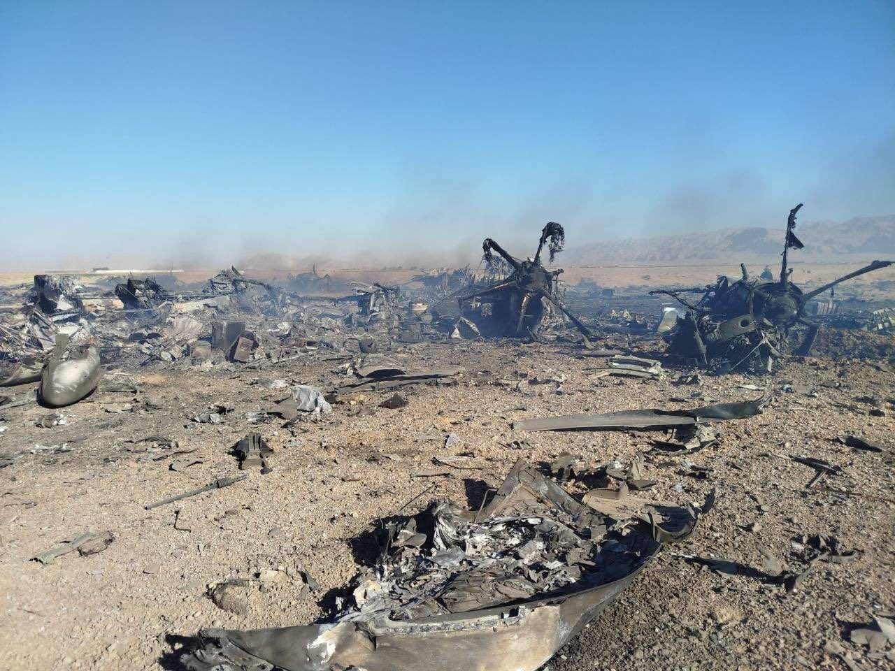 Remains of two destroyed MC-130J Commando IIs and several MH-6 Little Birds at forward base in iran