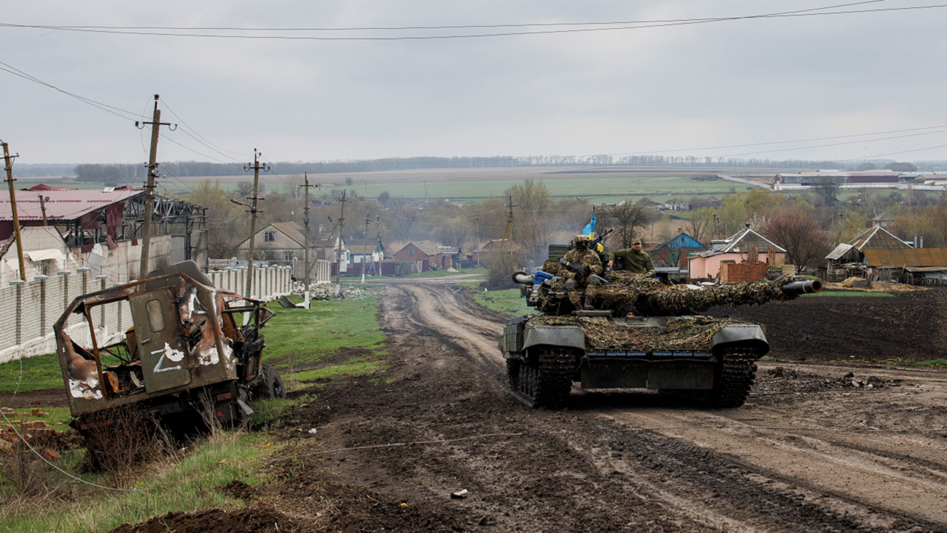 A Ukrainian tank drives next to a destroyed Russian vehicle in the Kharkiv region on April 14, Ukraine to Repair Its T-64 tanks, BRDM Amphibious Armored Scout Car in Czech Republic, Defense Express