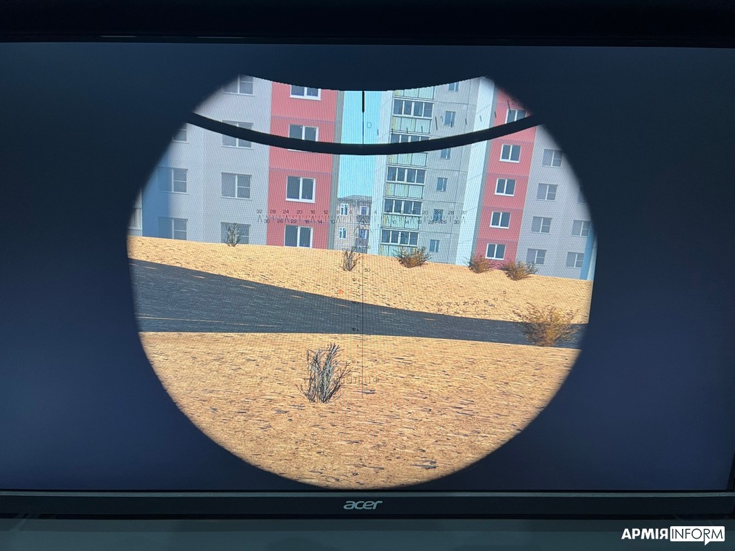 Image from the tank simulator, a gunner trains to destroy targets in the buildings