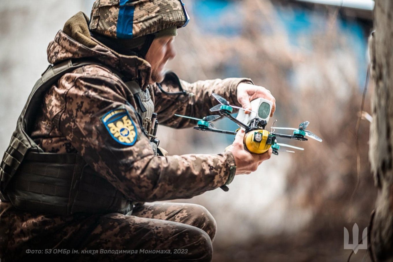 A fully equipped FPV drone, with an explosive and a battery, is ready to strike its target
