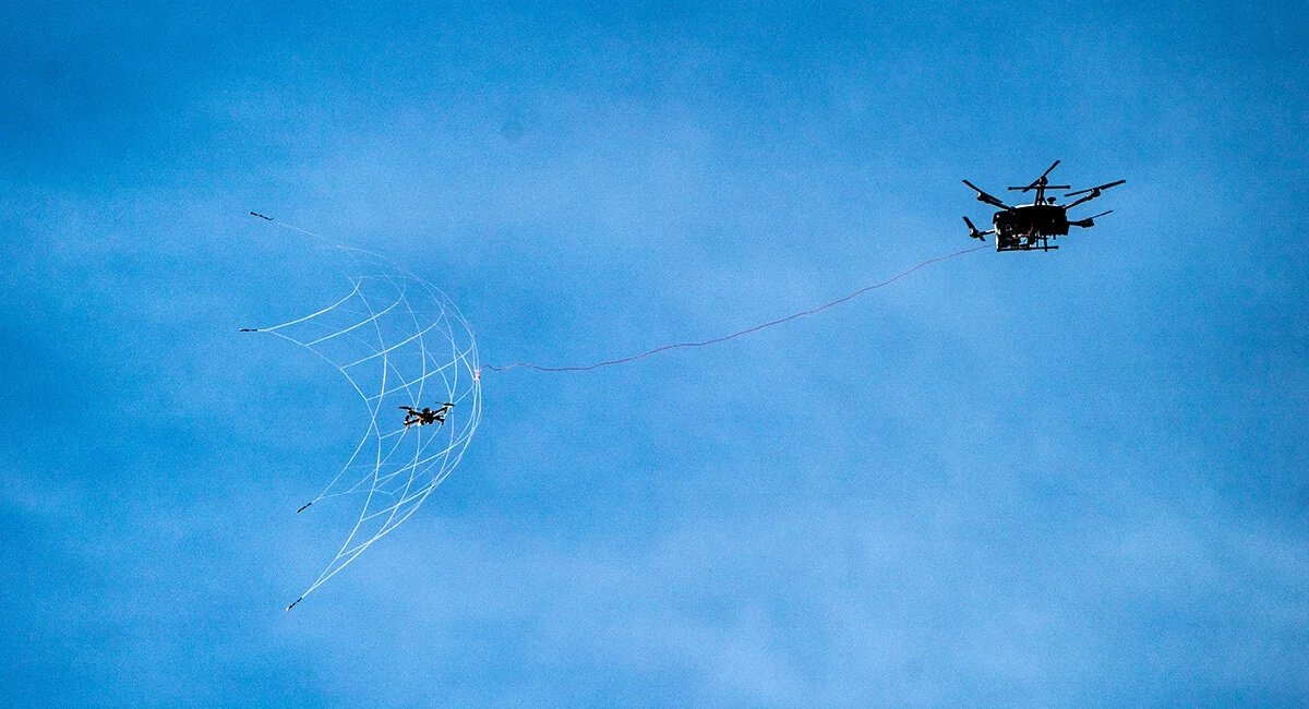 Drone Hunter F700 fires a net onto a target drone during demonstration tests / Defense Express / Ukrainian Fighters Destroying russian Lancet, Zala, and Mavic Drones (Video)