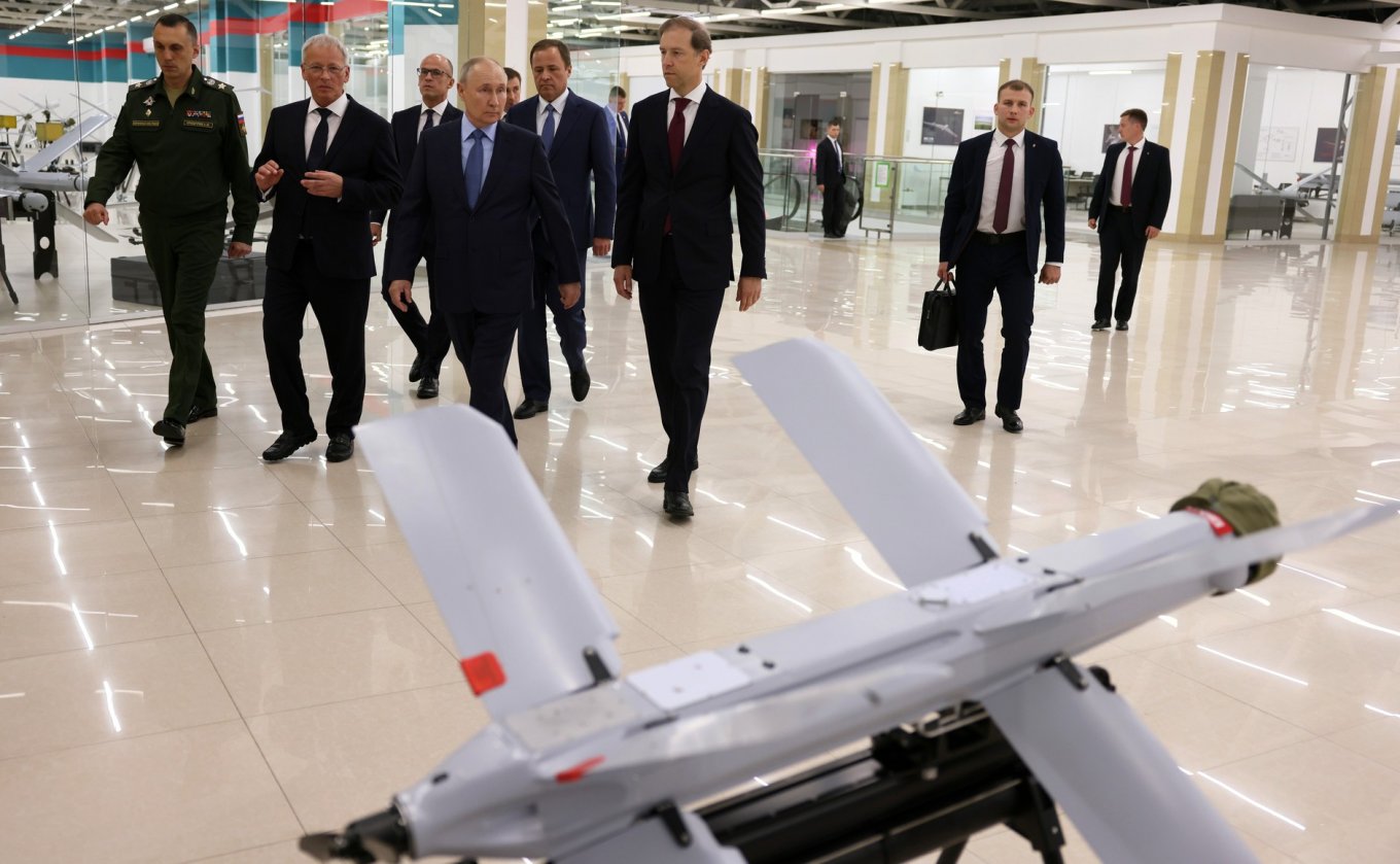 russian president Vladimir Putinwalking down the halls of the former 