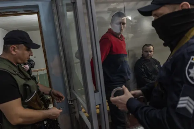 Russian soldiers Alexander Bobikin and Alexander Ivanov pictured at their trial in Kotelva, northeastern Ukraine, on Thursday 26 May, Defense Express