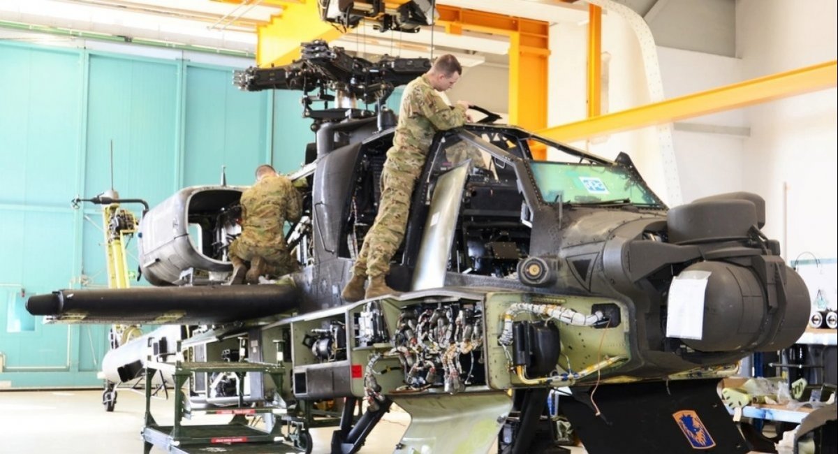 A scheduled maintenance of an AH-64 Apache helicopter that has flown 500 hours at an airfield in Germany / Photo credit: U.S. Army
