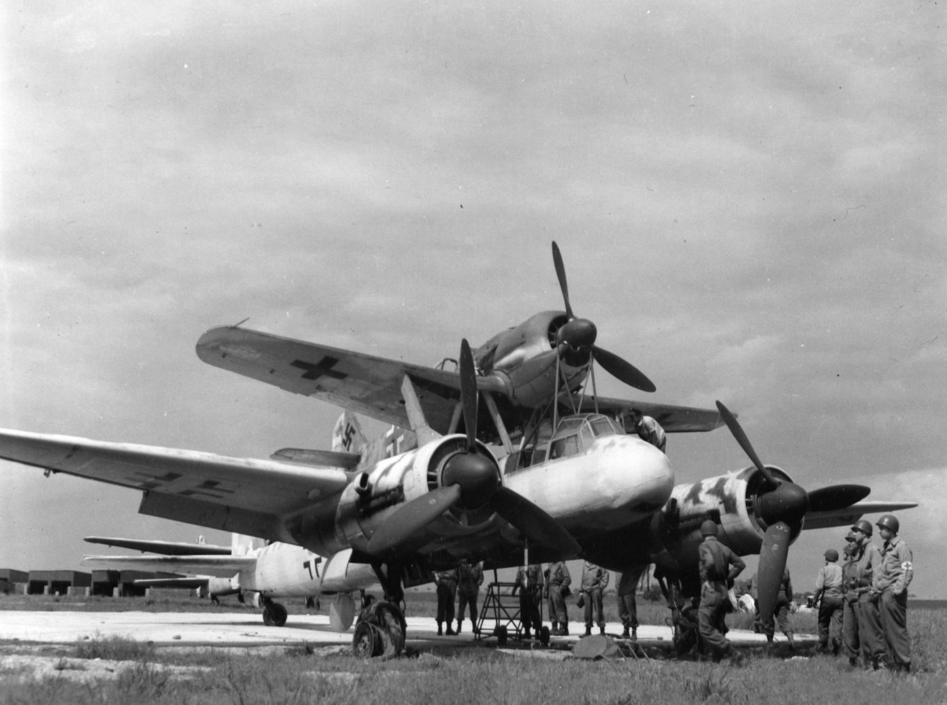 Ukraine Uses Not Only A-22 Aircraft, But Also Kamikaze Glider with a 100-kg Warhead for New Strike on Facility in russia, U.S. soldiers look over a German Junkers Ju 88/Focke-Wuld Fw 190