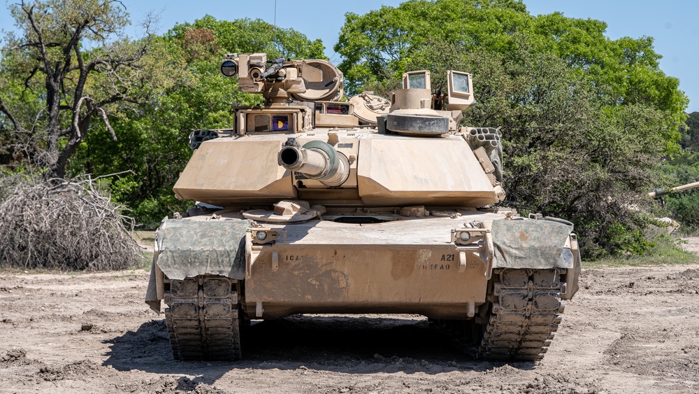 M1A2 SEPv3, where on the left side of the turret one can see a CROWS module, and a light machine gun on the right side near the loader's hatch, Abrams Tanks Now Armed With Legendary Miniguns — But the Gunner Is Left Exposed Even to Shrapnel and Drones