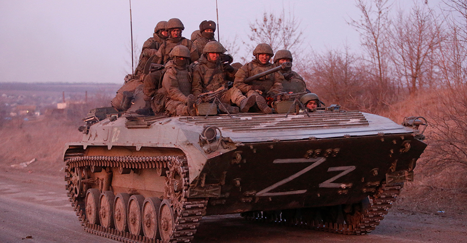 Invading Russian soldiers are seen atop of a BMP armored fighting vehicle / Representative photo