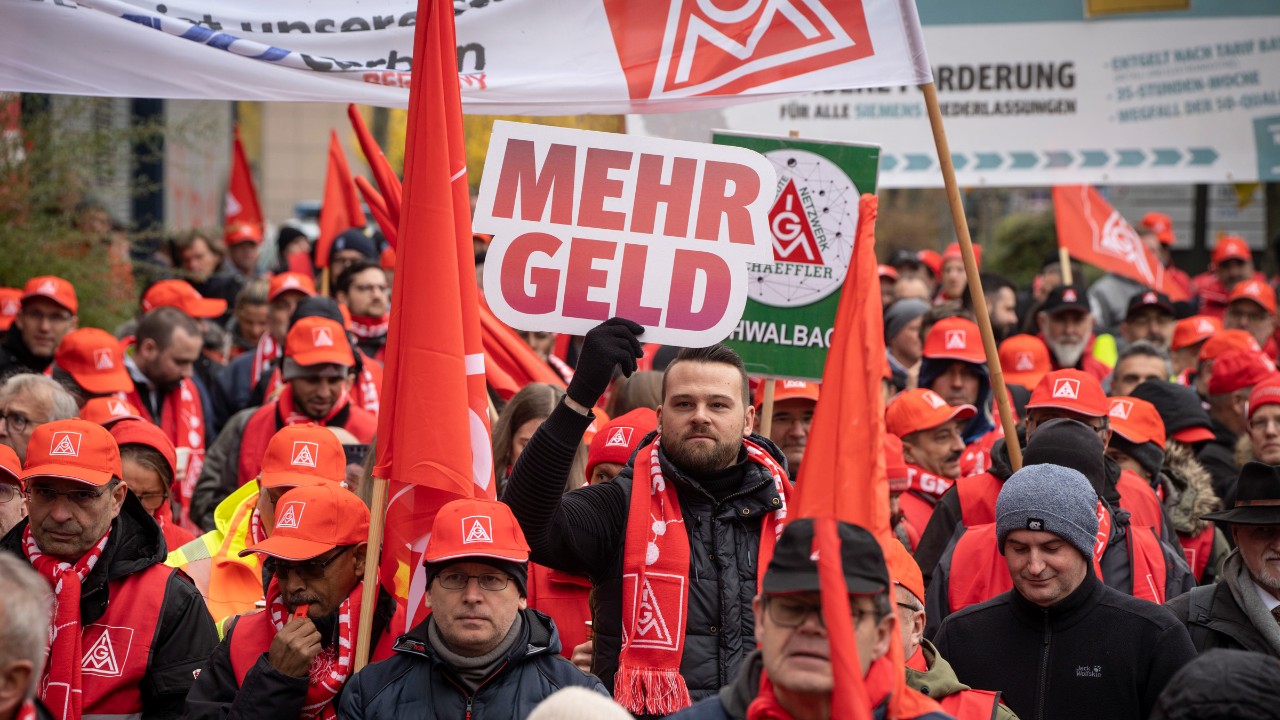 IG Metall rally, sign reads “more money”