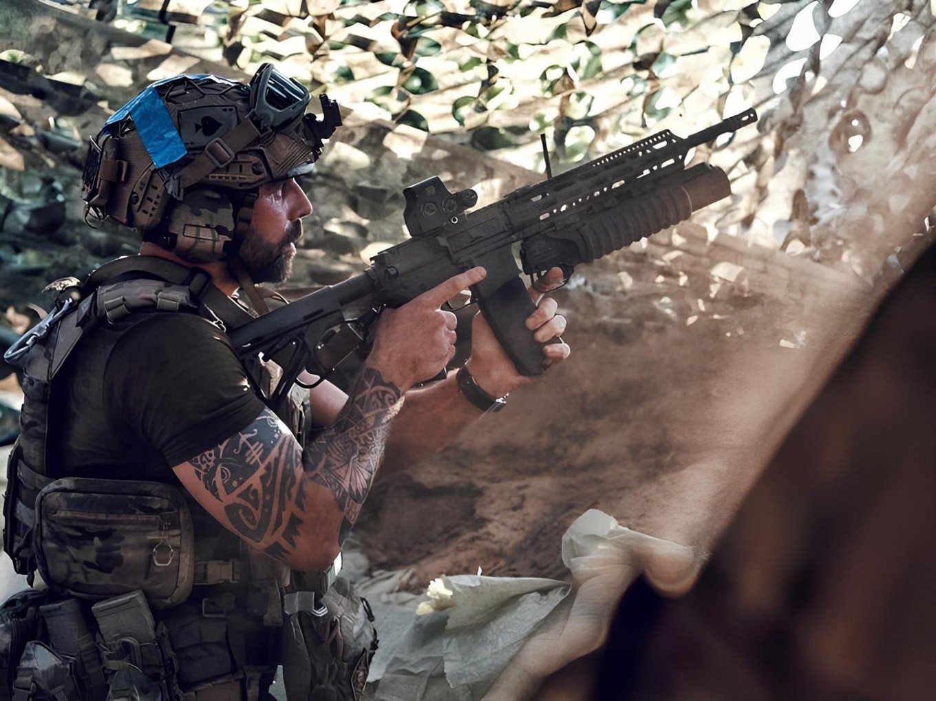 A Ukrainian serviceman with a domestically produced UAR-15 and under-barrel grenade launcher, July 2024