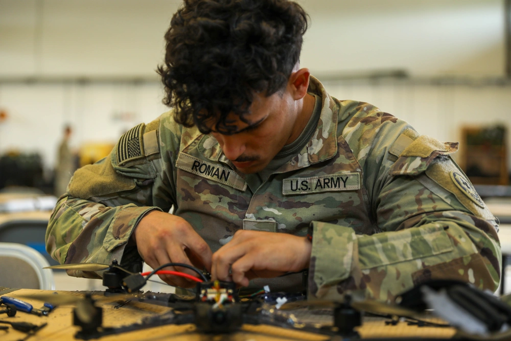 USASOC Is Jealous of Ukrainian Military's Ability to Modify Drones for Specific Tasks, As Companies Lag Behind Needs of Military, Work on an FPV drone in the US Army