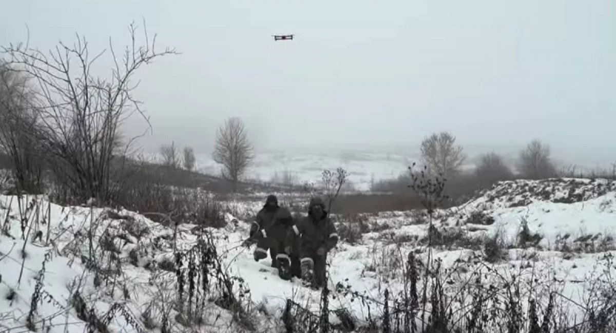 A frame from the demonstration video of the Armed Forces of Ukraine. russian military personnel follow a drone to surrender