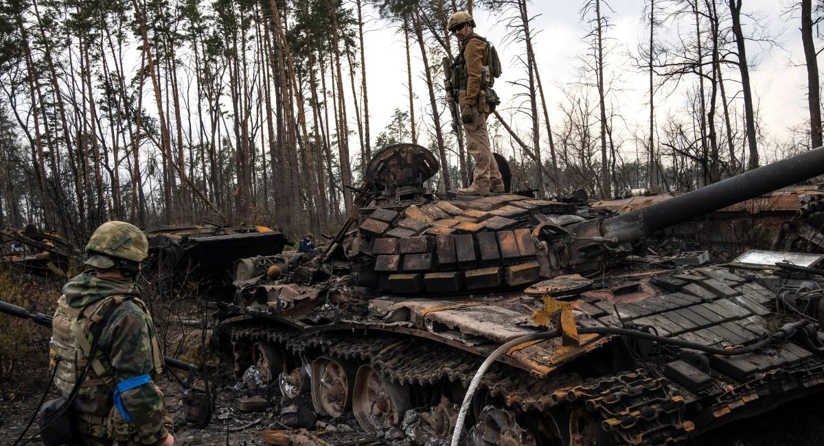 Photo for illustration / A Ukrainian soldier stands on top of a destroyed Russian tank on the outskirts of Kyiv on March 31, 2022., CNN