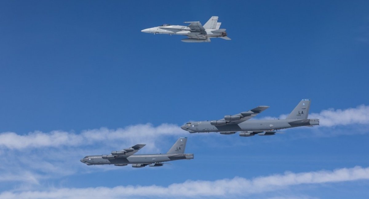 Two U.S. B-52 bombers escorted by a Finnish F/A-18 fighter jet. Photo: Finnish Air Force