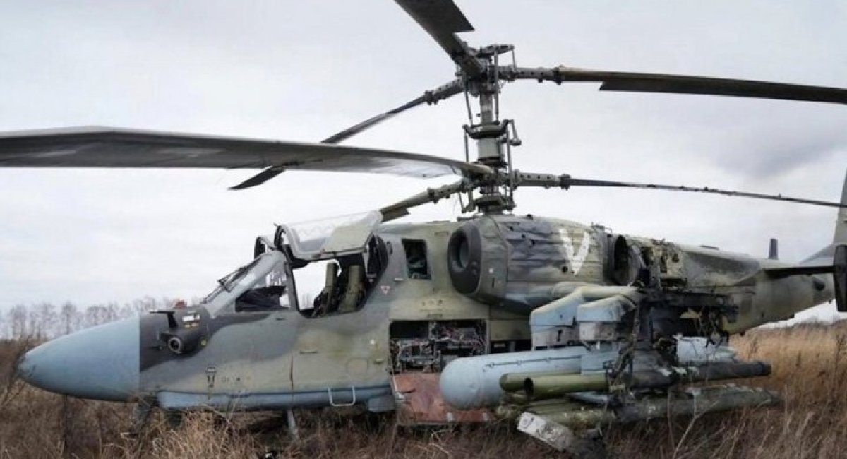 A russian Ka-52 helicopter gunship is seen in the field after a forced landing outside Kyiv, Ukraine, on Feb. 24, 2022, AP Photo - Efrem Lukatsky